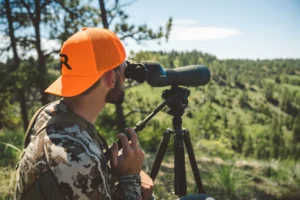 Hunter Wearing Custom Richardson Blaze Orange Hat With Embroidered Logo