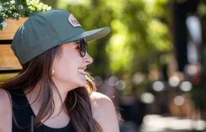 Woman Smiling Wearing Custom Decorated Richardson Hat