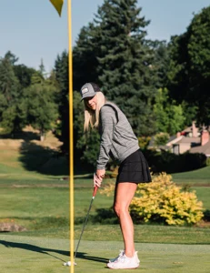Woman Golfer Wearing Custom Decorated Richardson Hat