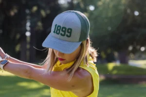 Golfer Wearing Custom Richardson Hats With Embroidered Logo