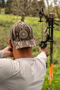 Hunter Wearing Custom Richardson Camo Hat With Logo Patch