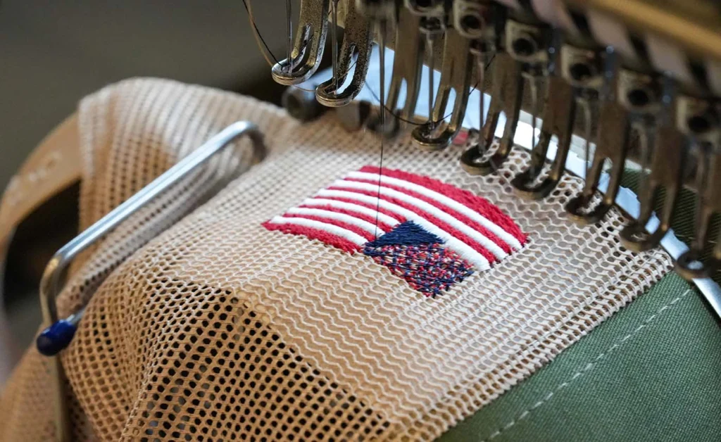 American Flag Being Sewn Onto Richardson Hat