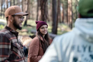Group Of People In Woods Talking & Wearing Blank Richardson Hats