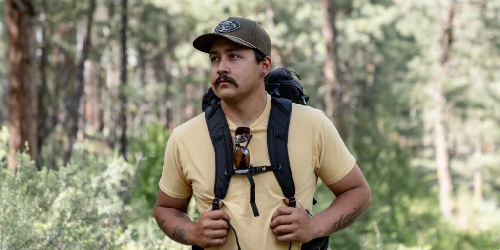 Man Hiking Wearing Custom Richardson 355 Hat In Grey