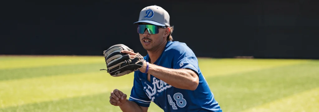 Baseball Player Wearing Custom Richardson Hat & Jersey With Team Logo