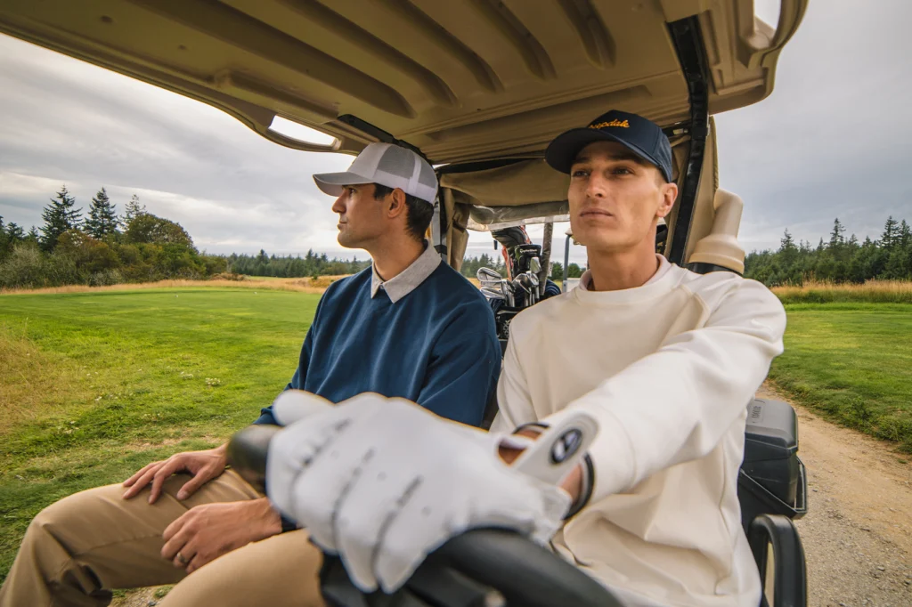 Golfers in golf cart wearing custom Richardson hats