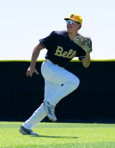 Baseball player wearing custom baseball uniform running on field