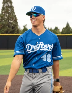 Baseball player pitching wearing custom baseball uniform and visor from Richardson