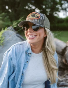 Woman wearing sunglasses and custom Richardson hat