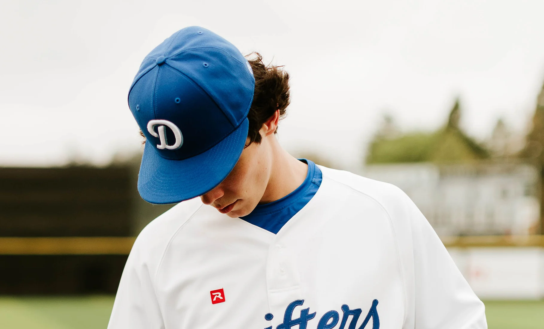 baseball player wearing custom richardson hat and uniform